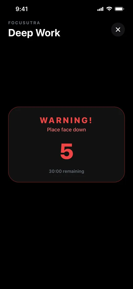 Focusutra warning screen with a 5-second countdown and the prompt: Place face down.